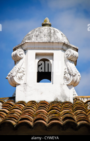 Spanish colonial chimney on a rooftop in Antigua Guatemala. Famous for its well-preserved Spanish baroque architecture as well as a number of ruins from earthquakes, Antigua Guatemala is a UNESCO World Heritage Site and former capital of Guatemala. Stock Photo