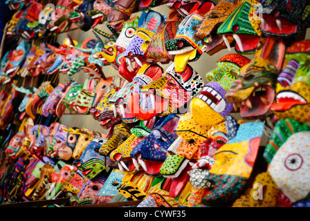 CHICHICASTENANGO, Guatemala - Colorful wooden masks for sale at Chichi's market. Chichicastenango is an indigenous Maya town in the Guatemalan highlands about 90 miles northwest of Guatemala City and at an elevation of nearly 6,500 feet. It is most famous for its markets on Sundays and Thursdays. Stock Photo