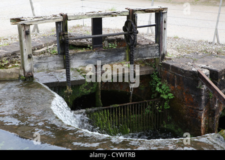 Old sluice gate on waterway at Cromford Mill, Derbyshire. Stock Photo