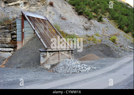 A roadside sieve, or screen, for sorting gravel to use on mountain roads in the Swiss alps. In the Gasteretal valley, Kandersteg Stock Photo