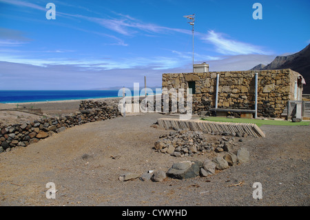 A stone cottage at the Atlantic Ocean on October 24, 2011 in Cofete, Fuerteventura Island, Spain Stock Photo