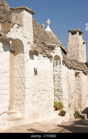 Exterior of traditional trulli houses in Alberobello (Puglia, Italy). Stock Photo