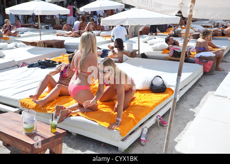 Sun bathers at Nikki Beach, Miami Beach, Florida, USA. Stock Photo