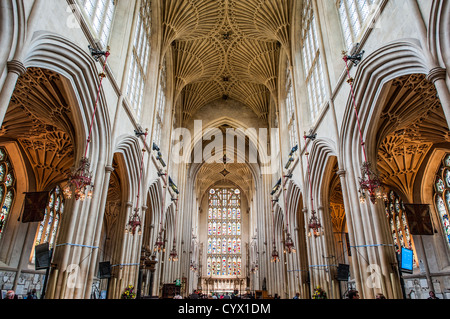 A view looking down the nave of Bath Abbey towards the altar. Bath Abbey (formally the Abbey Church of Saint Peter and Saint Paul) is an Anglican cathedral in Bath, Somerset, England. It was founded in the 7th century and rebuilt in the 12th and 16th centuries. Stock Photo