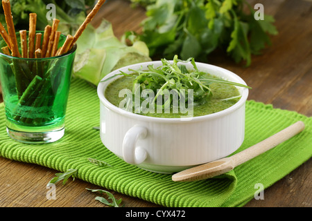 Cream soup  broccoli with arugula greens in a white bowl Stock Photo