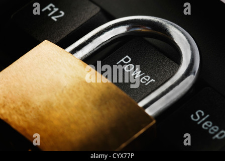 Padlock on a computer keyboard Stock Photo