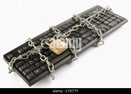 Computer keyboard locked with chain and padlock Stock Photo