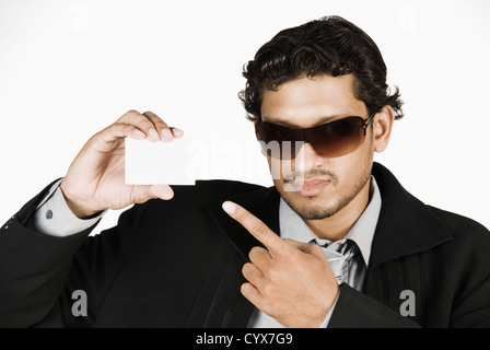 Businessman holding a blank placard Stock Photo