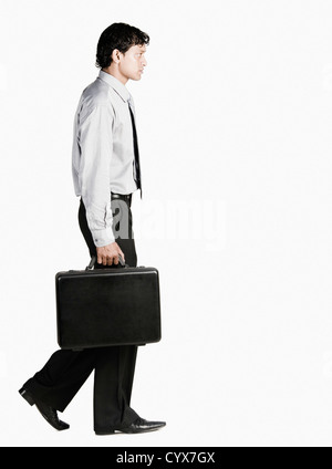Businessman walking with a briefcase Stock Photo