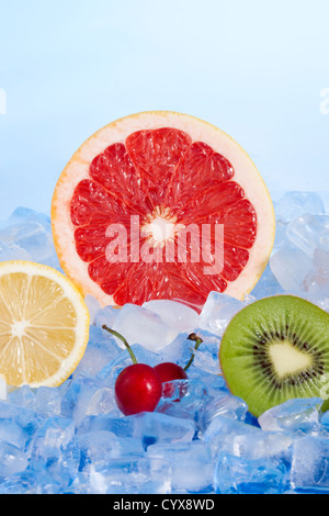 Freshly sliced fruits on ice Stock Photo