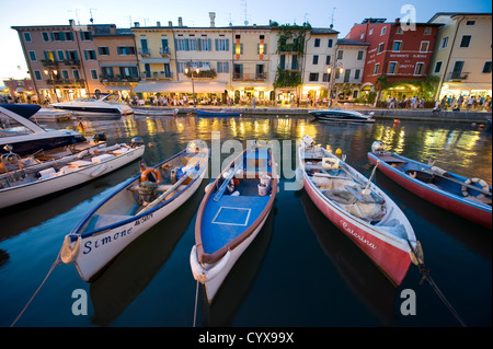 The romantic little harbor of Lazise at the Garda lake in Italy in the sunset Stock Photo