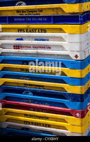 Stack of coloured fish boxes on the quayside at Wells-Next-the-Sea, Norfolk, UK Stock Photo