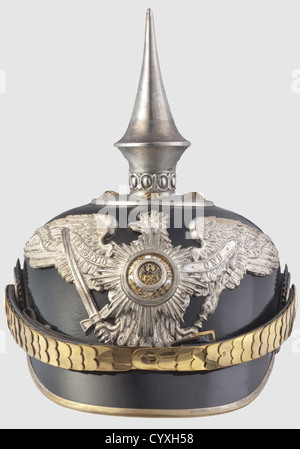 A helmet for officers,of the Prussian Guard Pioneer Batallion Black leather skull,enamelled Prussian Guard Star on a frosted silver eagle emblem,silvered spike and four officerïs stars on the base plate,flat gilt chin scales. Green ribbed silk liner,size '55' as well as an old pencil notation 'Garde Pioniere'. In a helmet box,lightly damaged. An extremely rare helmet in unusually good condition,historic,historical,19th century,Prussian,Prussia,German,Germany,militaria,military,object,objects,stills,clipping,clippings,cut out,cut-out,cut-o,Additional-Rights-Clearences-Not Available Stock Photo