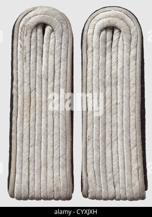 Pair of shoulder boards 'Untersturmführer' staff of 'Reichsführer SS Heinrich Himmler',light grey piping,with rear loop,unissued. Very rare,historic,historical,1930s,1930s,20th century,secret service,security service,secret services,security services,police,armed service,armed services,NS,National Socialism,Nazism,Third Reich,German Reich,Germany,utensil,piece of equipment,utensils,object,objects,stills,clipping,clippings,cut out,cut-out,cut-outs,fascism,fascistic,National Socialist,Nazi,Nazi period,uniform,uniforms,detai,Additional-Rights-Clearences-Not Available Stock Photo