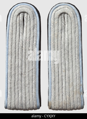 Pair of shoulder boards 'Untersturmführer' staff of 'Reichsführer SS Heinrich Himmler',light grey piping,with rear loop,unissued. Very rare,historic,historical,1930s,1930s,20th century,secret service,security service,secret services,security services,police,armed service,armed services,NS,National Socialism,Nazism,Third Reich,German Reich,Germany,utensil,piece of equipment,utensils,object,objects,stills,clipping,clippings,cut out,cut-out,cut-outs,fascism,fascistic,National Socialist,Nazi,Nazi period,uniform,uniforms,detai,Additional-Rights-Clearences-Not Available Stock Photo