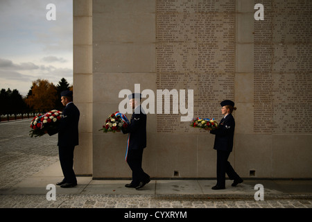 LUXEMBOURG – Airmen from Ramstein Air Base, Germany, carry wreaths during a Veterans Day ceremony at the Luxembourg American Cemetery and Memorial Nov. 11, 2012. The distinguished visitors at the ceremony laid wreaths in honor of service members past and Stock Photo