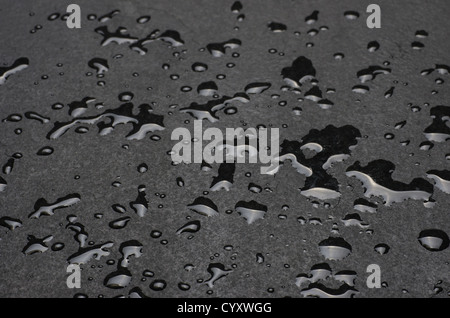Macro shot of a slate plate with water drops Stock Photo