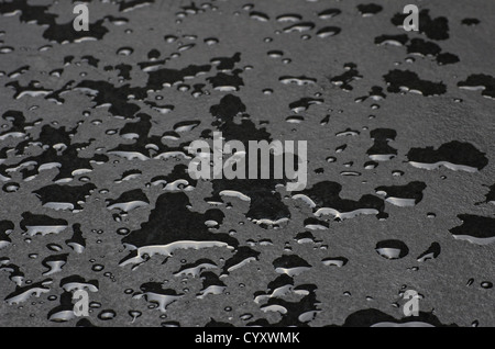 Macro shot of a slate plate with water drops Stock Photo