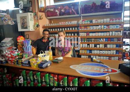 Proprietors in mini market Kos town, island of Kos, Greece Stock Photo