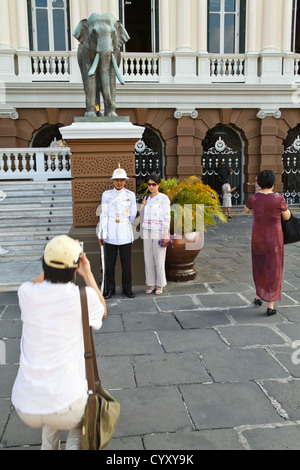 Tourists taking Photos of the Royal Palace Guard in Bangkok, Thailand Stock Photo