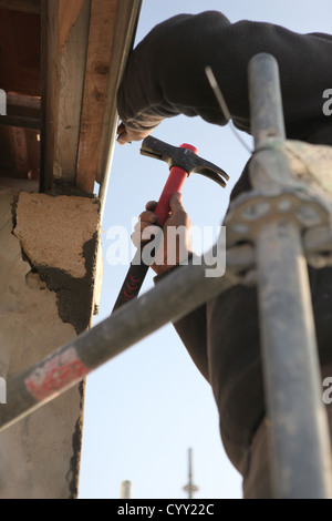 Close-up of a man on scaffolding Stock Photo