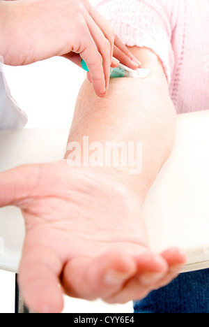 Senior woman arm getting blood analysis. Stock Photo