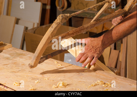 Carpenter hands using traditional tools Stock Photo