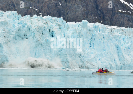 Sea kayakers watching the Margerie Glacier calving into Glacier Bay, Alaska. Stock Photo