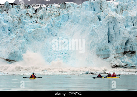 Sea kayakers watching the Margerie Glacier calving into Glacier Bay, Alaska. Stock Photo