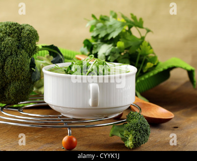 Cream soup  broccoli with arugula greens in a white bowl Stock Photo