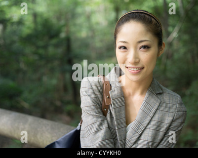 Beautiful young Japanese woman visiting Meiji Jingu Shrine, Tokyo Stock Photo