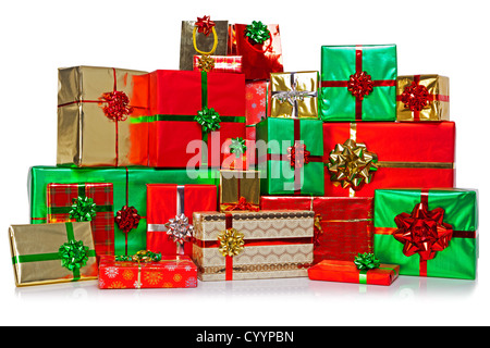 A large group of gift wrapped Christmas presents in a colourful variety of wrapping paper with ribbons and bows Stock Photo