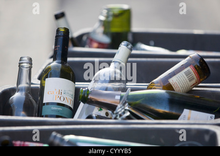 Recycling Glass Wine Bottles in a recycling bin ready for collection Stock Photo