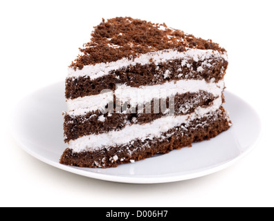 Slice of chocolate cake stuffed with whipped cream and white chocolate on white background Stock Photo