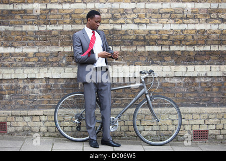 Portrait of African American businessman with Bicycle Stock Photo