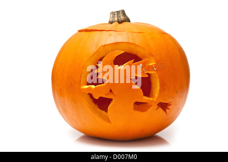 Witch on a broomstick, Halloween pumpkin lantern isolated on a white studio background. Stock Photo