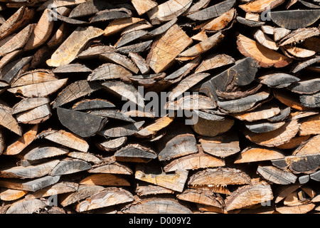 Background of dry chopped firewood logs in a pile Stock Photo