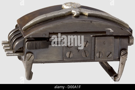 A 'German SS Belt Buckle Gun',cal..22 l.r,no.4/c.Matching numbers.Four barrels,length 43 mm.Wehrmacht eagle on hinged lid,at the bottom two-line inscription: 'BLN.- 44 - SS / R.V.F.Z.Nr.4/c'.Patinated,spotted finish.Dimensions without belt loops approx.110 x 55 x 43 mm.Very good,fully functioning condition.Extremely rare.Operational sequence: When left-sided upper and lower ribbed levers are pressed simultaneously,the hinged lid and barrels spring open.Shots are released by pressing the now accessible ribbed triggers on the left.Simultane,Additional-Rights-Clearences-Not Available Stock Photo