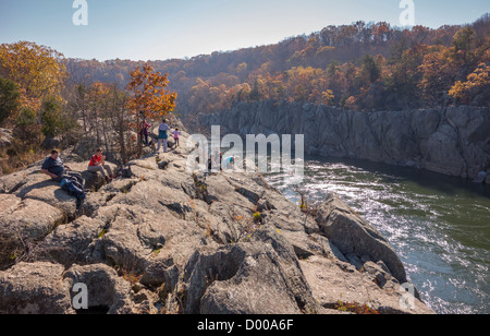GREAT FALLS, MARYLAND, USA - Hikers by Potomac River downstream from Great Falls. Stock Photo