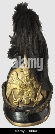 A model 1809 helmet for officers of the Line Cuirassiers,High black leather helmet of the Russian pattern with protective padding on the sides.The leather comb,set with brass in front,bears a horsehair plume inclined toward the front with a wire loop to prevent the plume from drooping to the sides.Leather peak with brass trim.Large insignia plate in front,bearing a separately applied Prussian eagle in relief.Moderately preserved gilding.Brass metal chinscales.Silk Prussian cockade on the left.Sheepskin lining.Age damage,which has already been resto,Additional-Rights-Clearences-Not Available Stock Photo