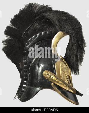A model 1809 helmet for officers of the Line Cuirassiers,High black leather helmet of the Russian pattern with protective padding on the sides.The leather comb,set with brass in front,bears a horsehair plume inclined toward the front with a wire loop to prevent the plume from drooping to the sides.Leather peak with brass trim.Large insignia plate in front,bearing a separately applied Prussian eagle in relief.Moderately preserved gilding.Brass metal chinscales.Silk Prussian cockade on the left.Sheepskin lining.Age damage,which has already been resto,Additional-Rights-Clearences-Not Available Stock Photo