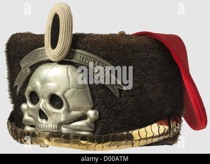 A busby for non-commissioned officers,of the 1st Life Hussar Regiment. Brown-black seal fur,sewn to it a red cloth bag,cap-lines,curved fatherland scroll,skull device of white metal. Convex chinscales fastened to rosette pins,cockade for enlisted men,field insignia of white silk cord and black velvet. Silk rep lining. Privately purchased piece,historic,historical,19th century,Prussian,Prussia,German,Germany,militaria,military,object,objects,stills,clipping,clippings,cut out,cut-out,cut-outs,uniform,uniforms,clothes,piece of clothing,,Additional-Rights-Clearences-Not Available Stock Photo