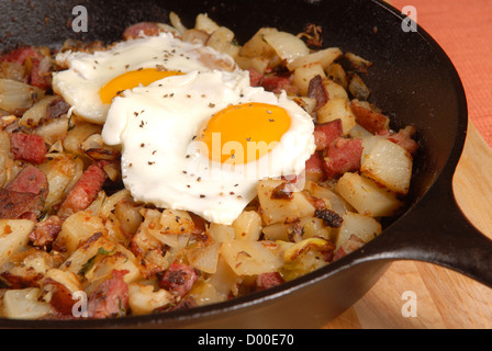 Southern breakfast of corned beef hash and sunny side up eggs Stock Photo