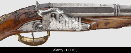 A cased pair of Czech percussion pistols,Thaddäus Poltz,Karlovy Vary,circa 1770.Octagonal two-stage barrels in 14 mm calibre,round and smooth after a girdle,with surface-mounted brass front sights.At the breeches remnants of gilt floral engravings as well as the numbers '1' and '2'.Florally cut,converted percussion locks,each signed 'Thaddeius Poltz'.Carved,bright walnut stocks with horn noses and bronze fittings with rocailles in relief.Wooden ramrods with horn tips.Length 33.5 cm each.In a later(?)wooden case complete with extensive accessorie,Additional-Rights-Clearences-Not Available Stock Photo