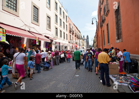 Calle Moneda - long avenue in Historical Centre of Mexico City DF , Traders operate from sidewalks. Stock Photo