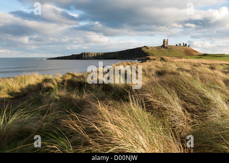 Dunstanburgh Castle in early November afternoon light Stock Photo