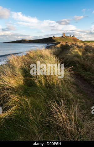 Dunstanburgh Castle in early November afternoon light Stock Photo