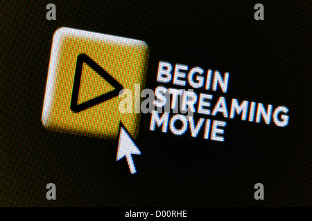 Close up of a fictional website featuring an button which invites users to begin streaming a movie. Stock Photo