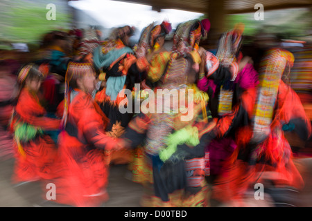 Kalash women and girls dancing at the Kalash Joshi (Spring Festival), Grum Village Charso (dancing ground), Rumbur Valley, Chitral, Khyber-Pakhtunkhwa, Pakistan Stock Photo