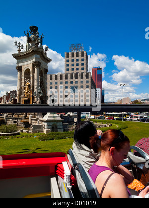 Tourists on an open top double decker sightseeing bus in Barcelona city centre Catalonia Spain Stock Photo